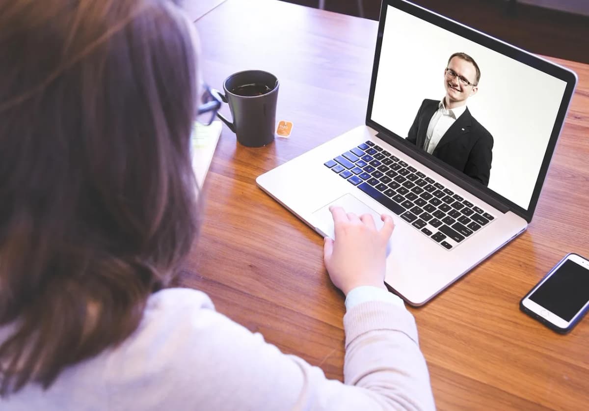 A laptop showing a video call, as employers report AI use in online interviews
