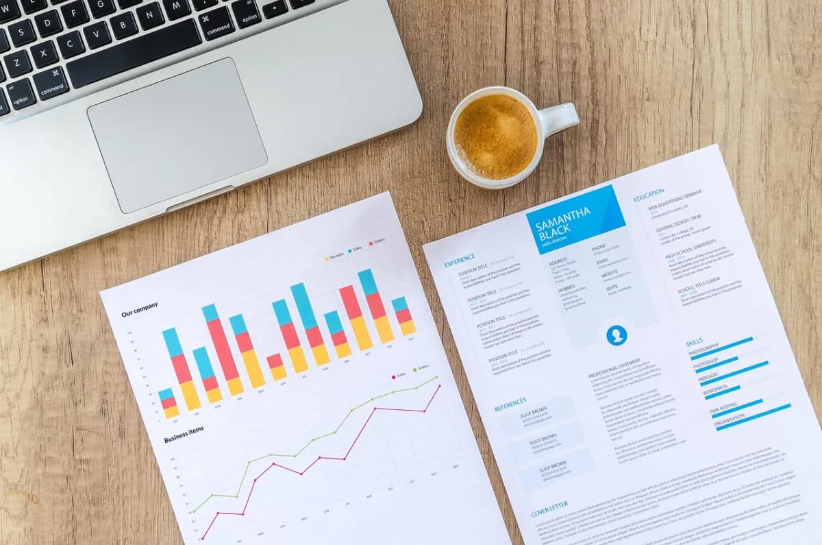 Charts and data on paper, as more job seekers tailor CVs for AI screening