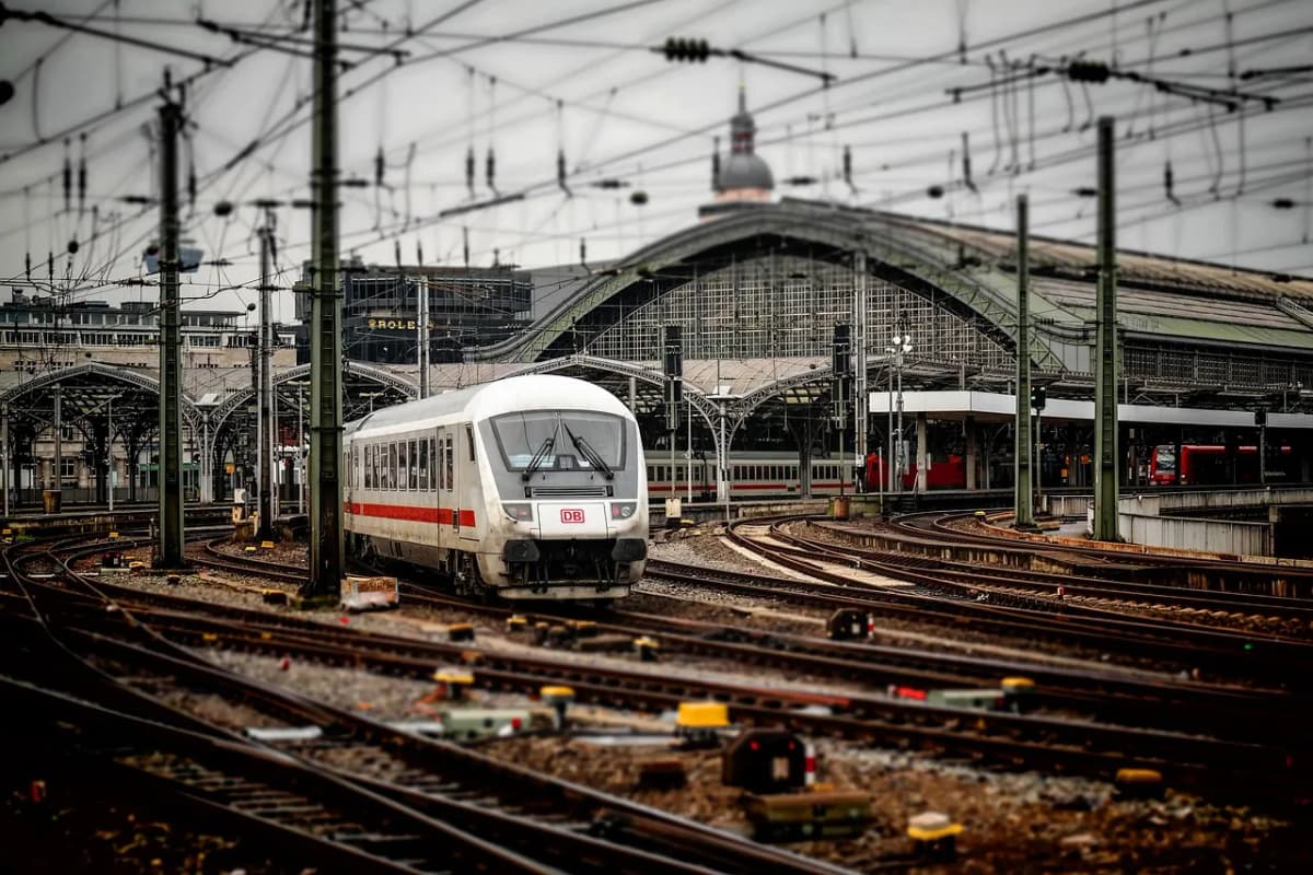 Train tracks leading into a railway station