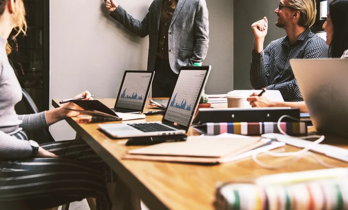 A team working together at laptops in an office