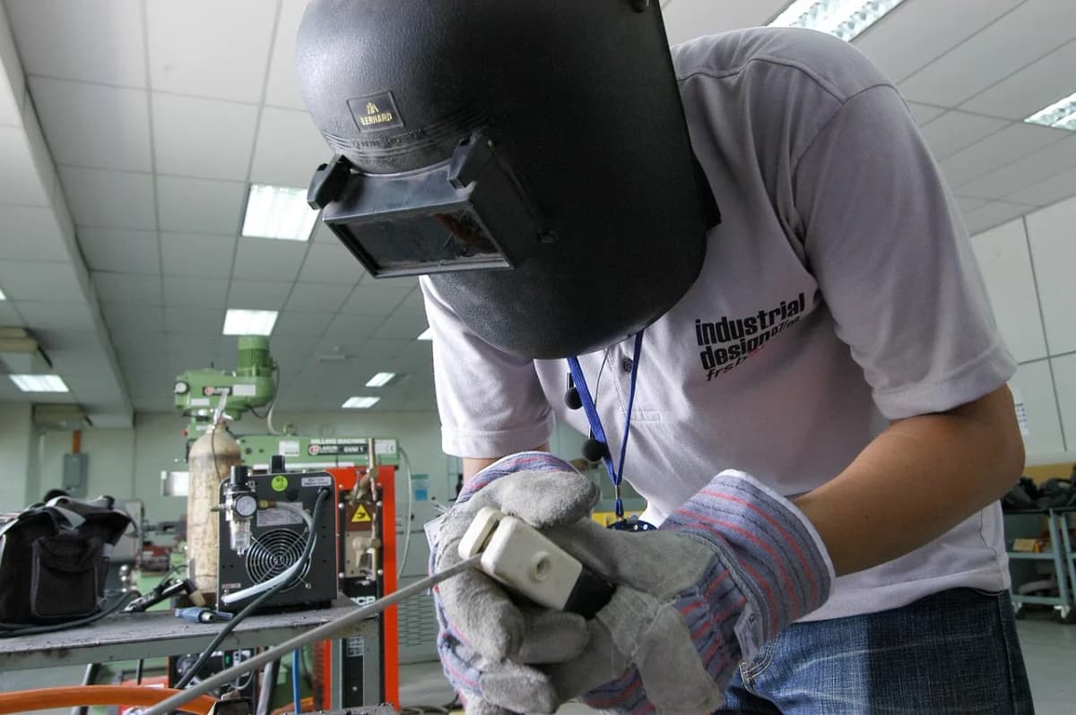 A welder at work in a workshop, as the UK backs youth apprenticeships
