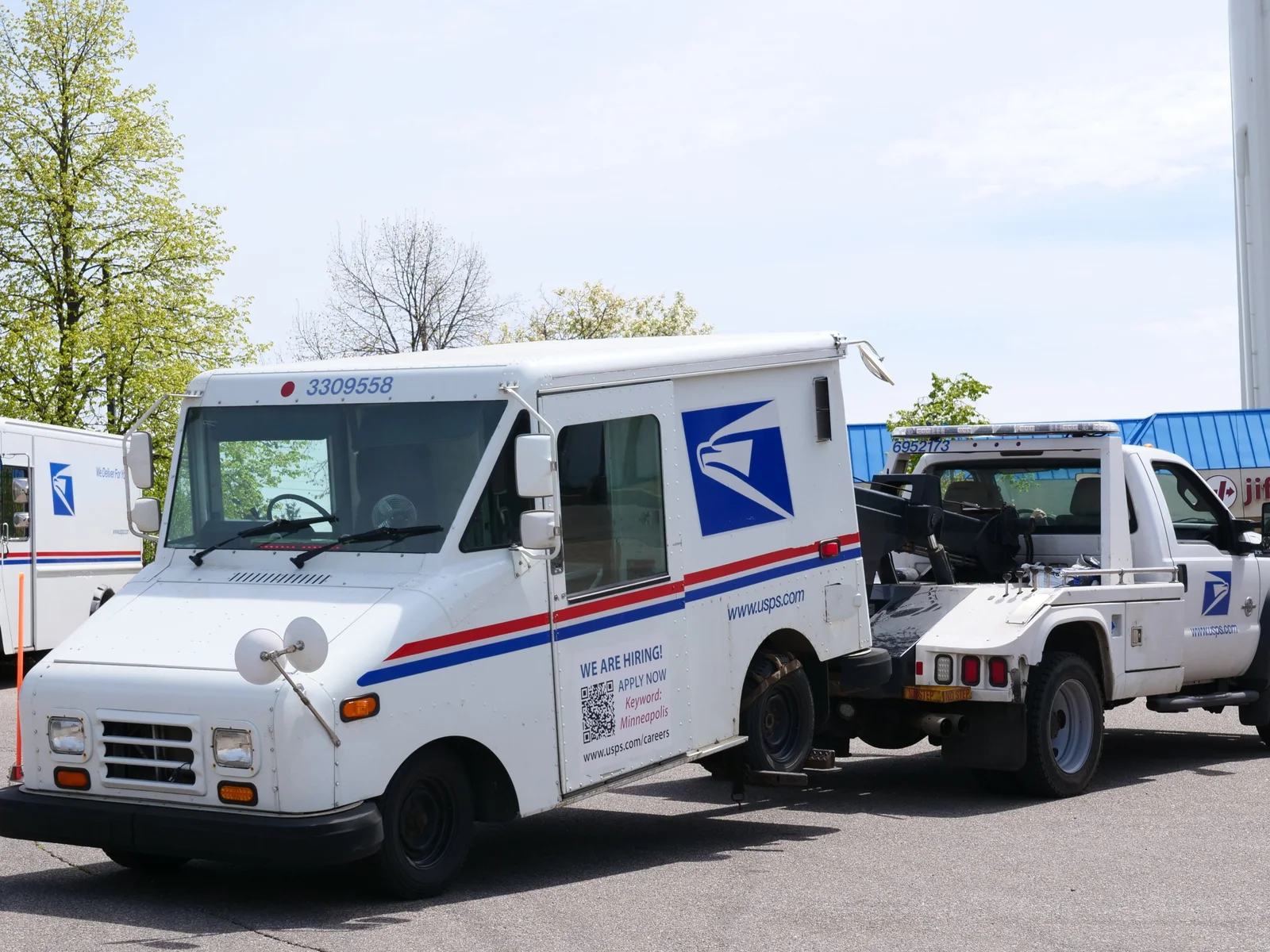 USPS mail carrier delivering mail on a residential route, us postal careers