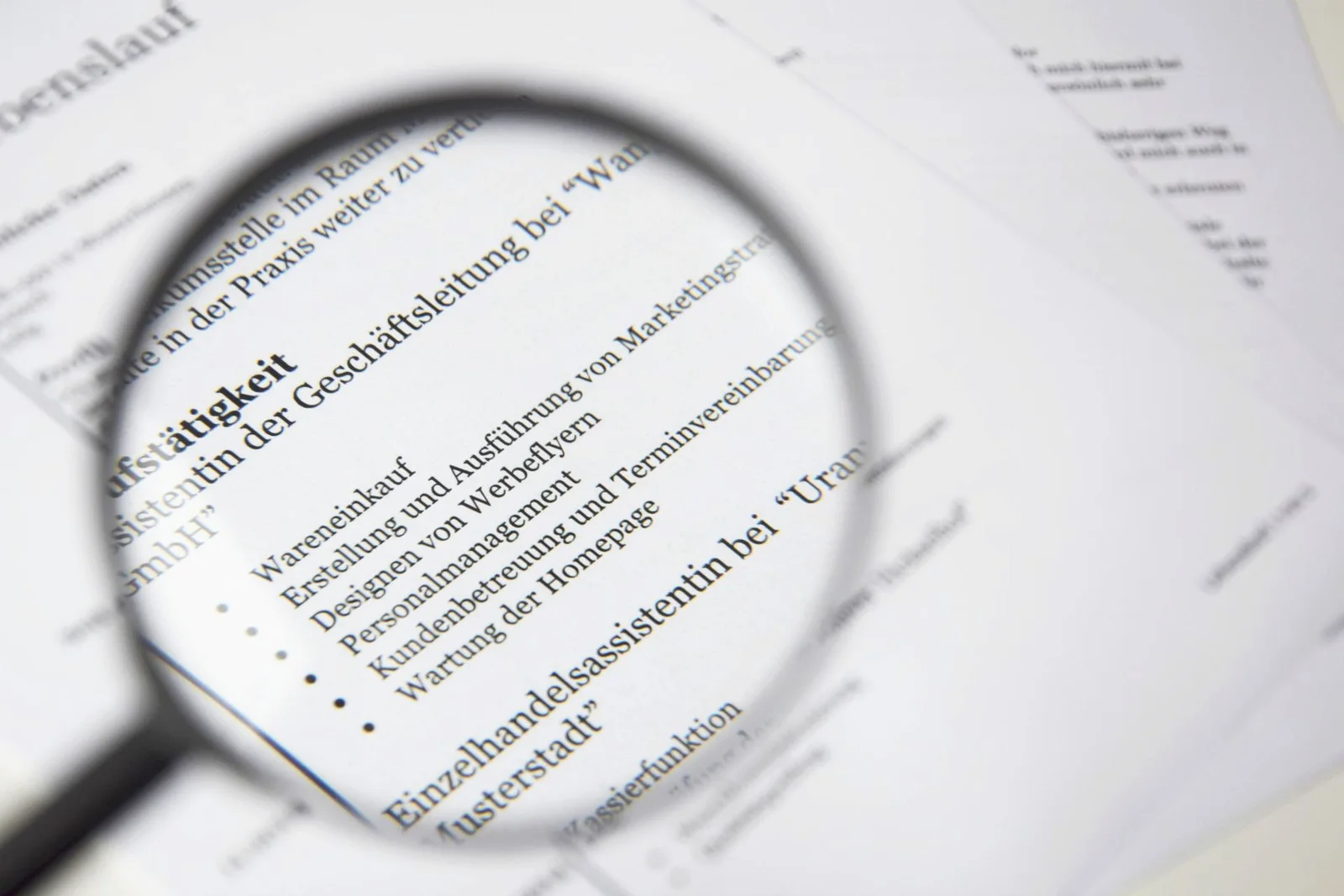Professional reviewing an AI-proof resume with measurable achievements, verified skills, and evidence of work experience.