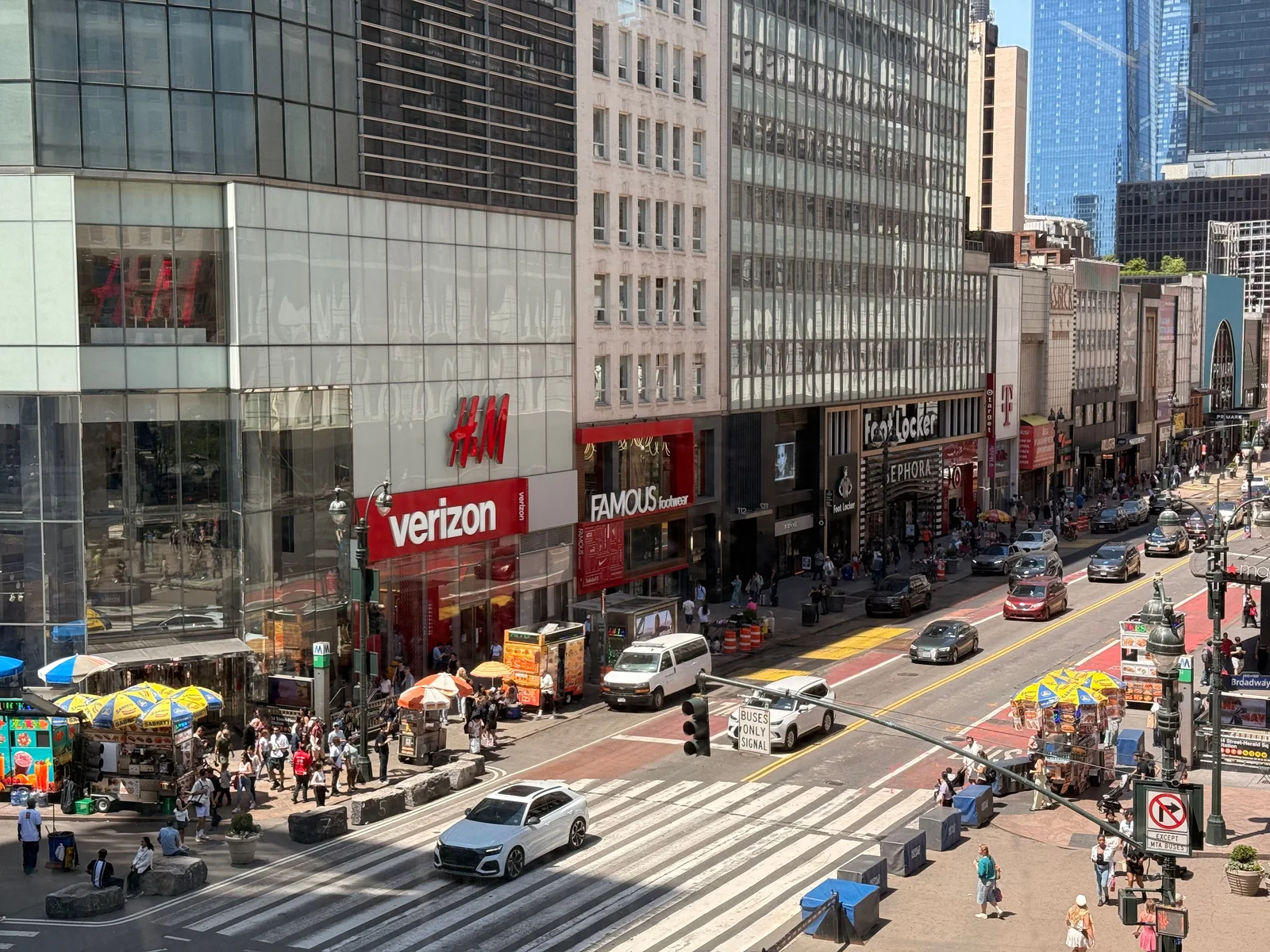 Verizon layoffs 2026: Verizon retail store signage on a city street.