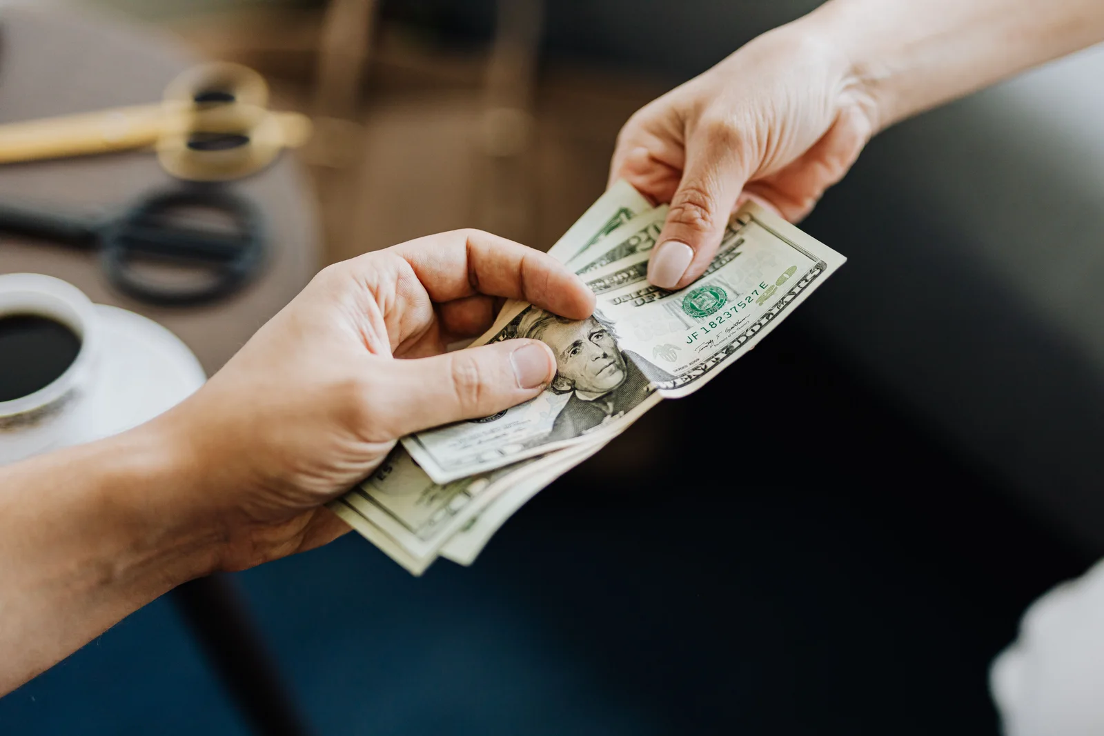 Job seeker reviewing a posted salary range and comparing minimum, midpoint and maximum pay before salary negotiation.