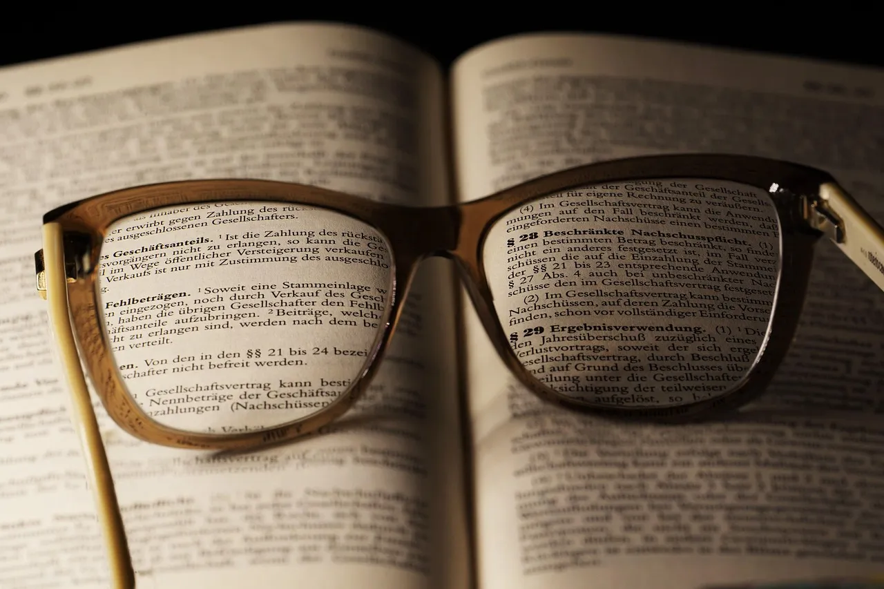 Printed pages spread on a desk, as recruiters report stress over AI-polished resumes